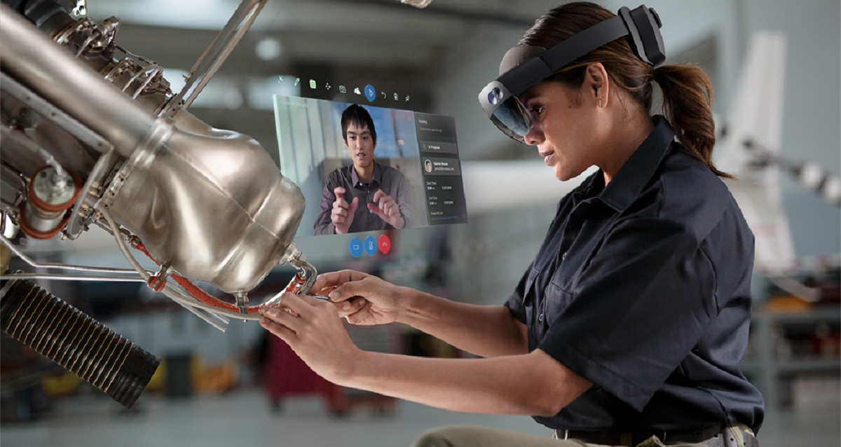 person working while on Microsoft HoloLens video conference