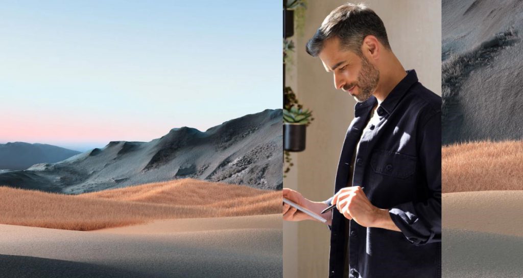 Man using stylus on a tablet, overlaid on a mountainous landscape photo