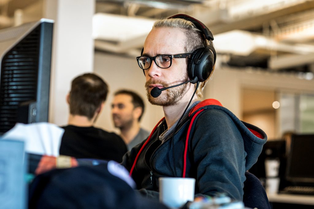 Person on headset at computer